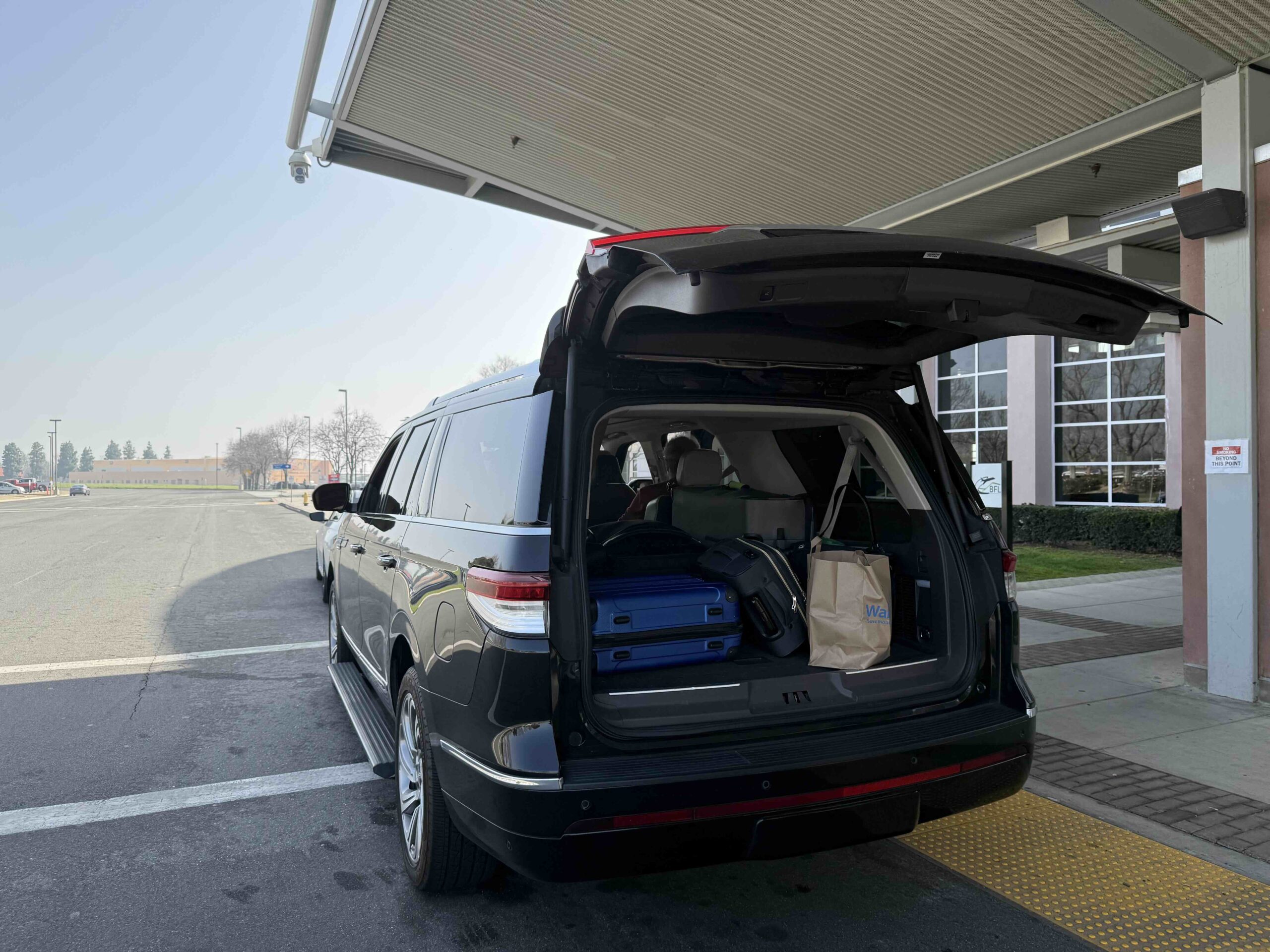 LAX to Irvine car service luxury SUV private airport transfer chauffeur Irvine California Emelx