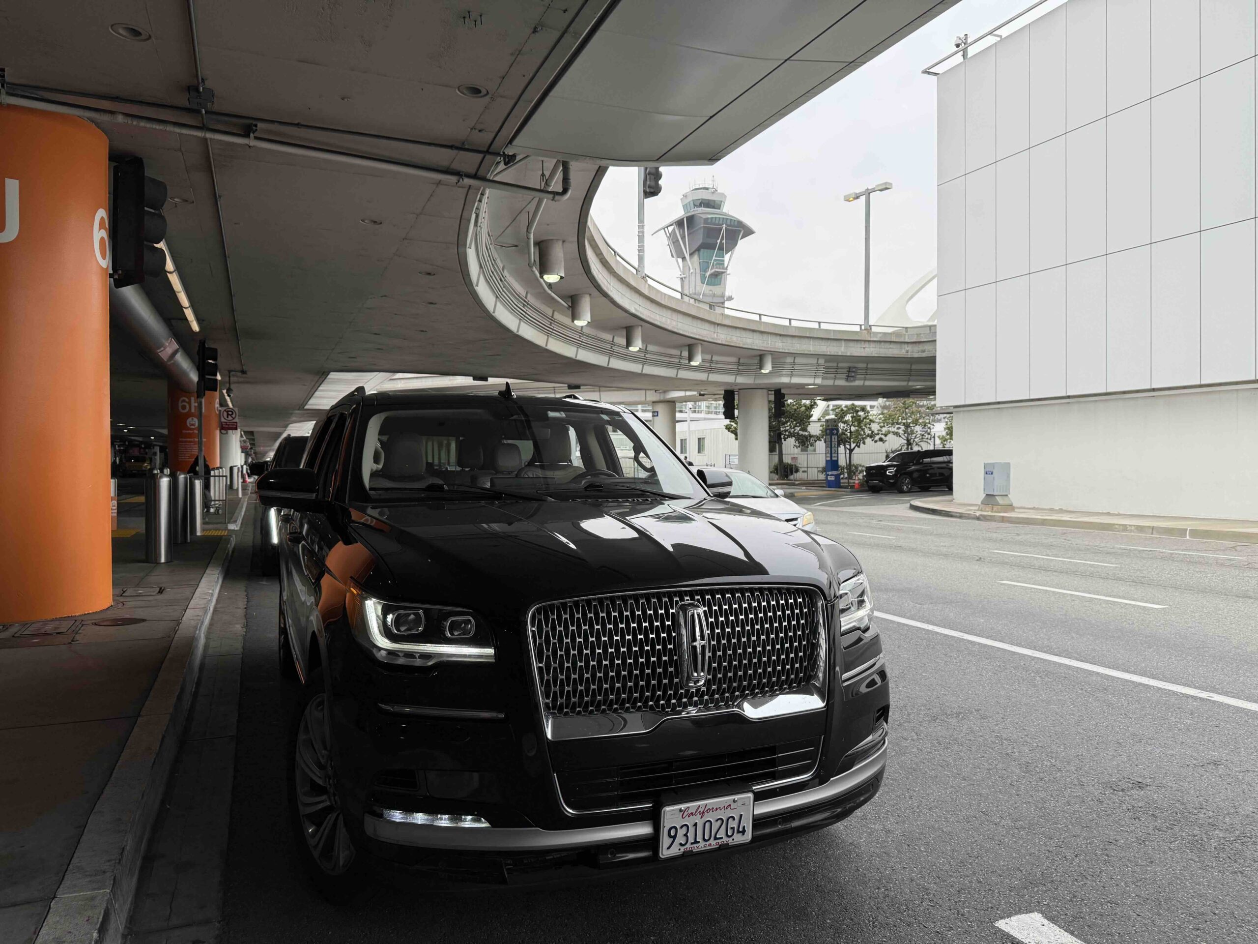 LAX to Irvine black car service luxury SUV airport pickup Emelx flat rate transfer