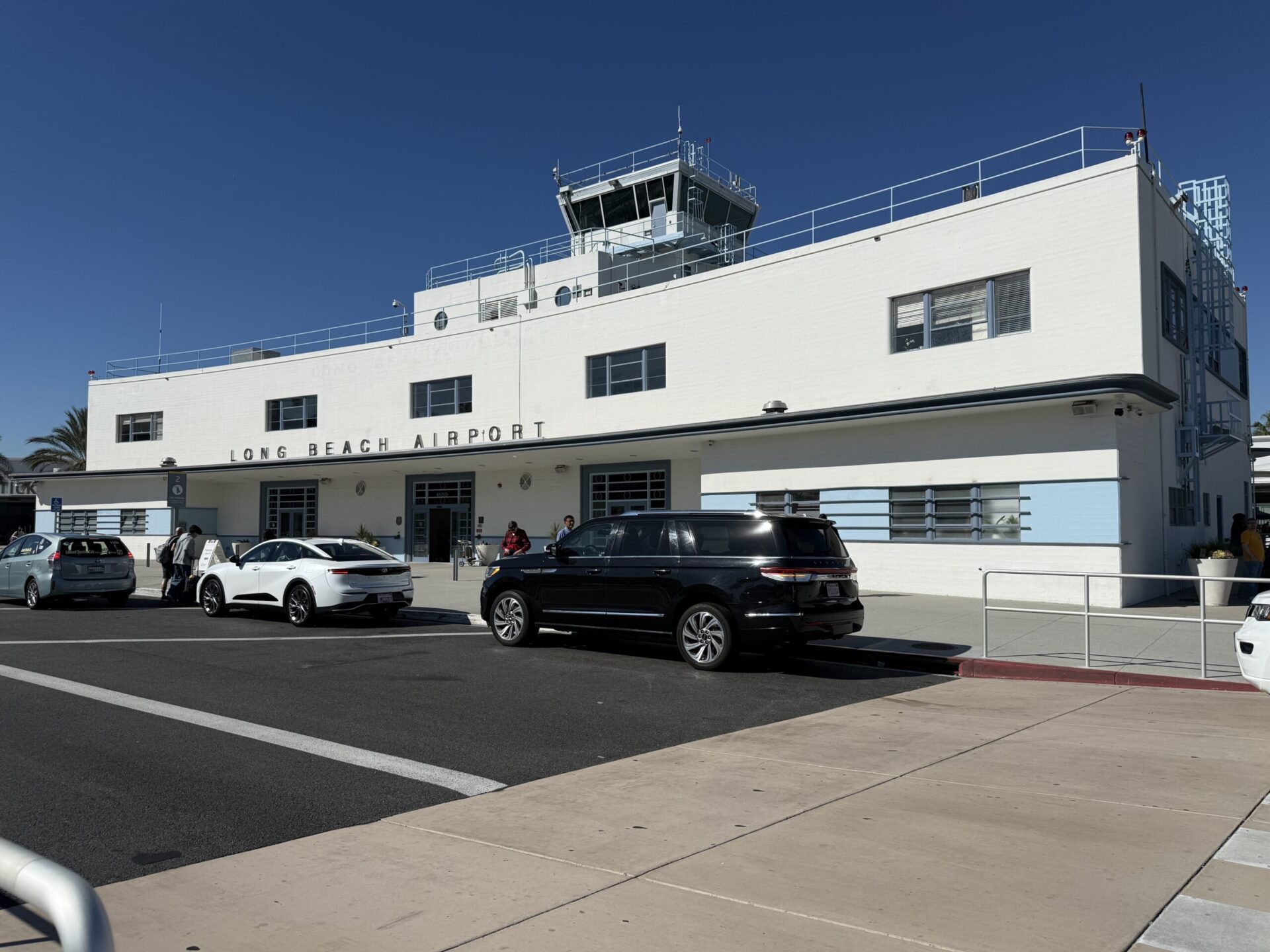 LAX to Long Beach car service luxury SUV airport transfer chauffeur Long Beach cruise terminal downtown Emelx