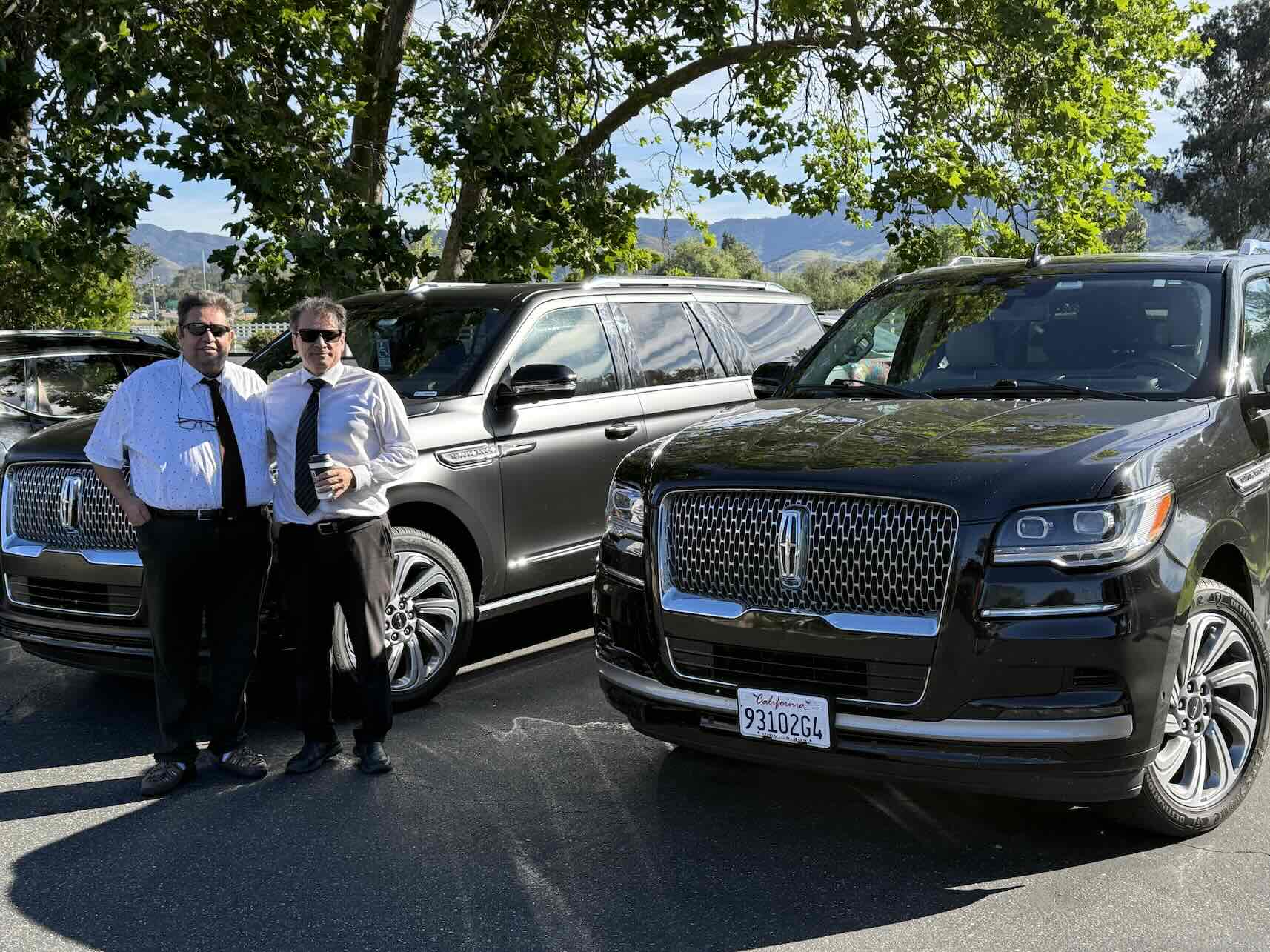 Emelx luxury LAX car service with a professional chauffeur and private airport transportation vehicle